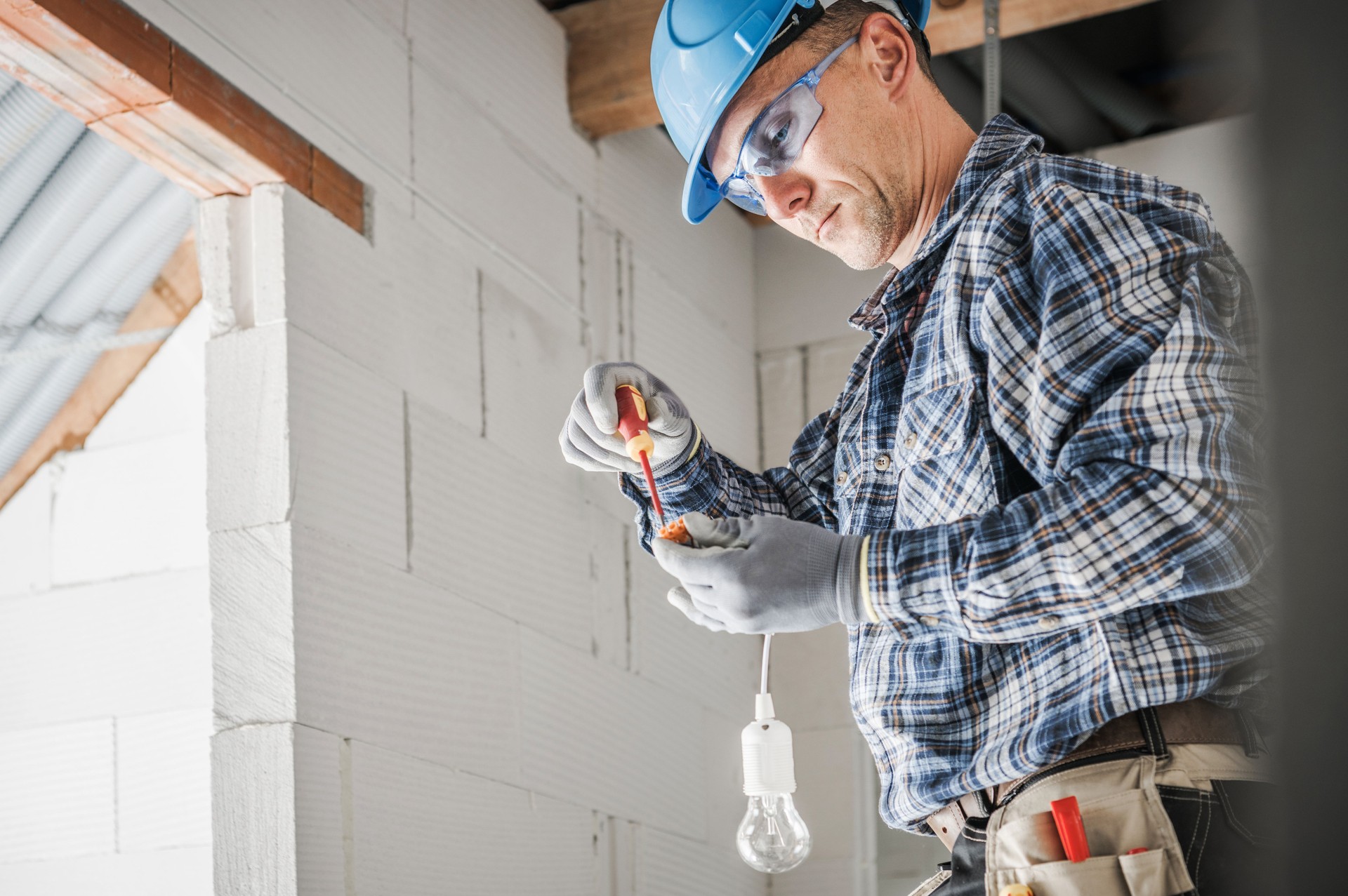 Electrician Preparing a Light Point Inside Newly Built House